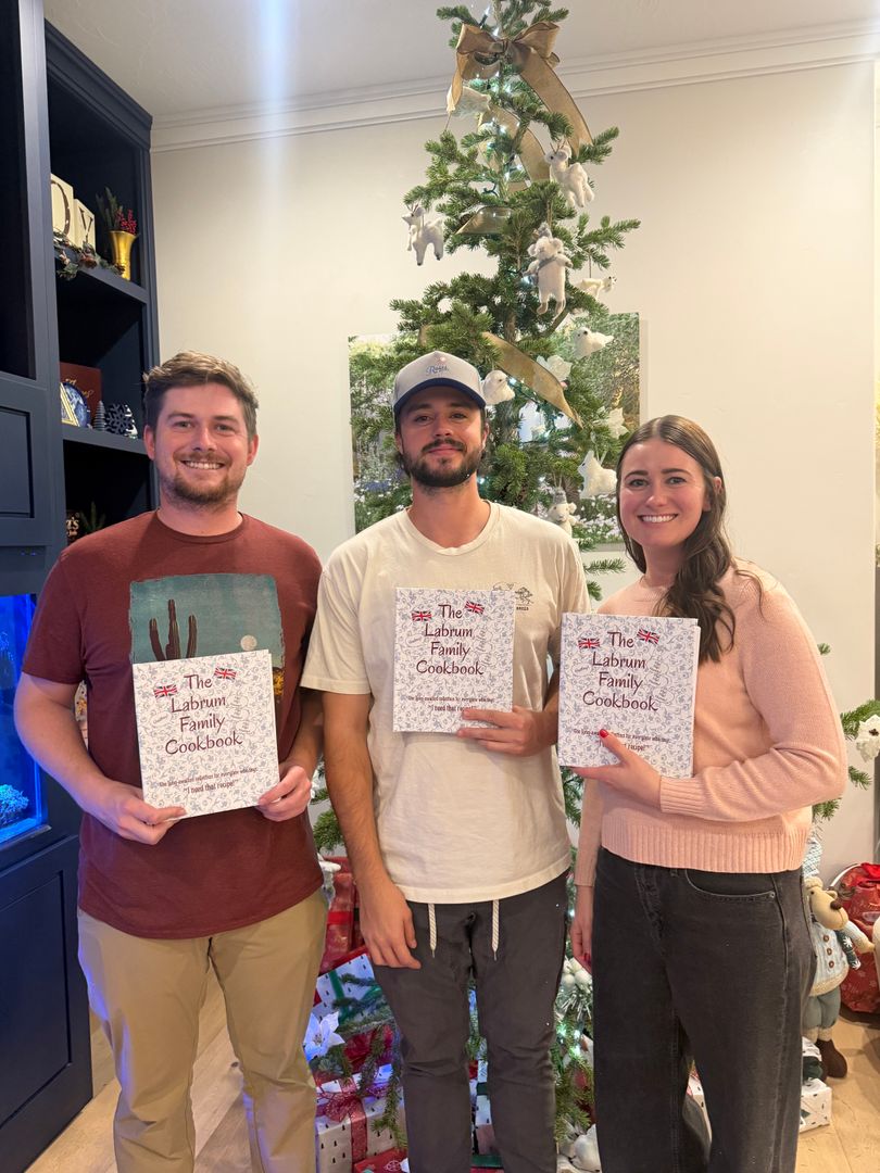Siblings with their family cookbook